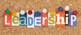 The word "Leadership" pinned to a bulletin board