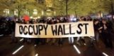 People carrying Occupy Wall St. banner