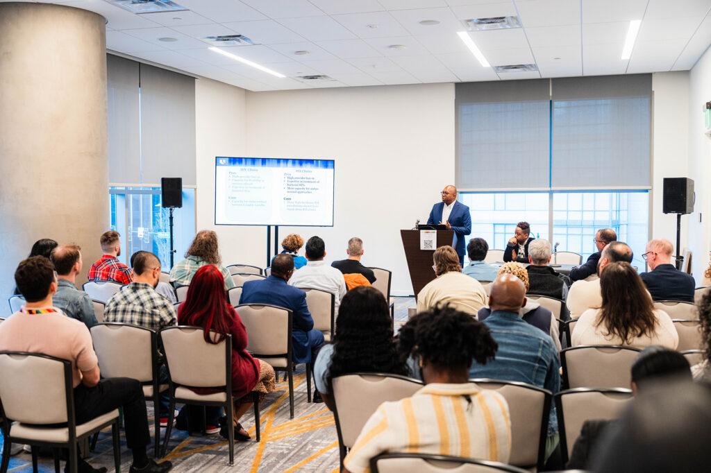 People attending a panel at Biomedical H.I.V. Summit