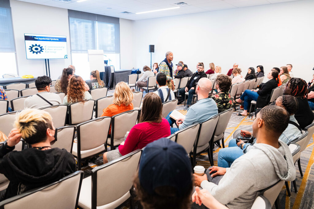 People attending a panel at Biomedical H.I.V. Summit